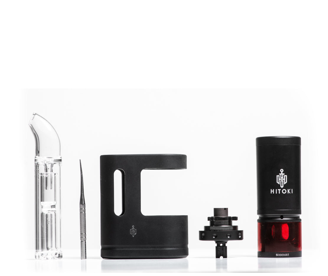 Hitoki Saber Portable Kit displayed on a white background, showcasing the laser-powered device, glass mouthpiece, loading chamber, and essential accessories.