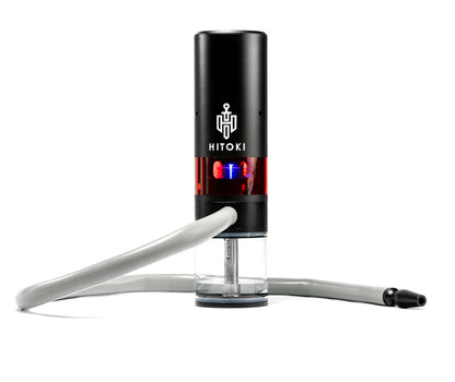 Hitoki Trident featuring high-tech laser combustion device with hose attachment for smooth, efficient smoking. Sleek design and advanced technology for a premium smoking experience