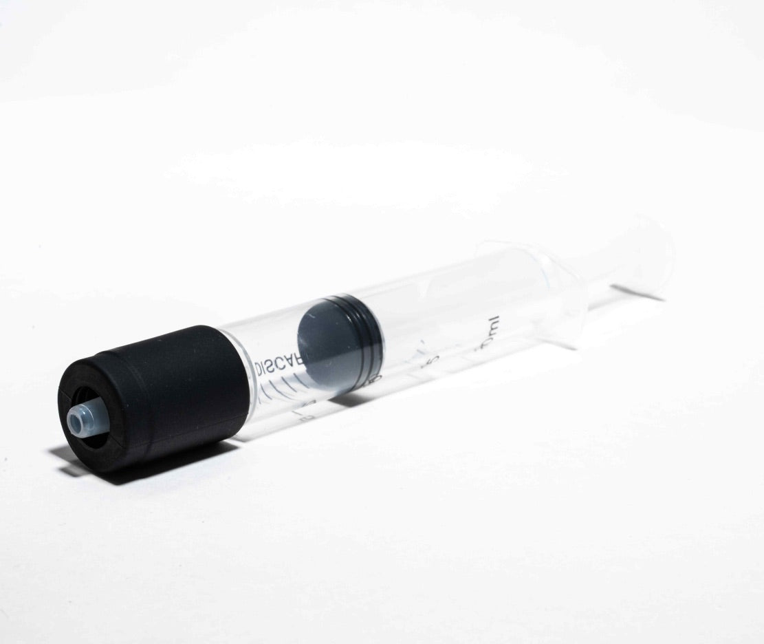 Hitoki Cleaning Kit syringe fully assembled with adapter, prepared for use with Trident or Saber.