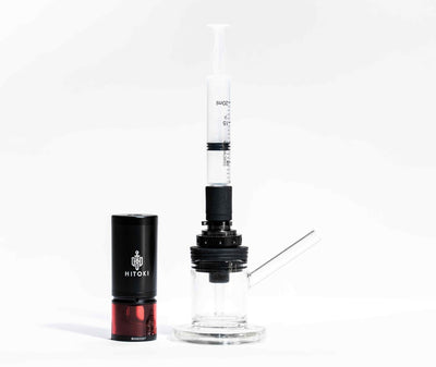 Hitoki Cleaning Kit connected to Saber device loading chamber, demonstrating simple cleaning process.