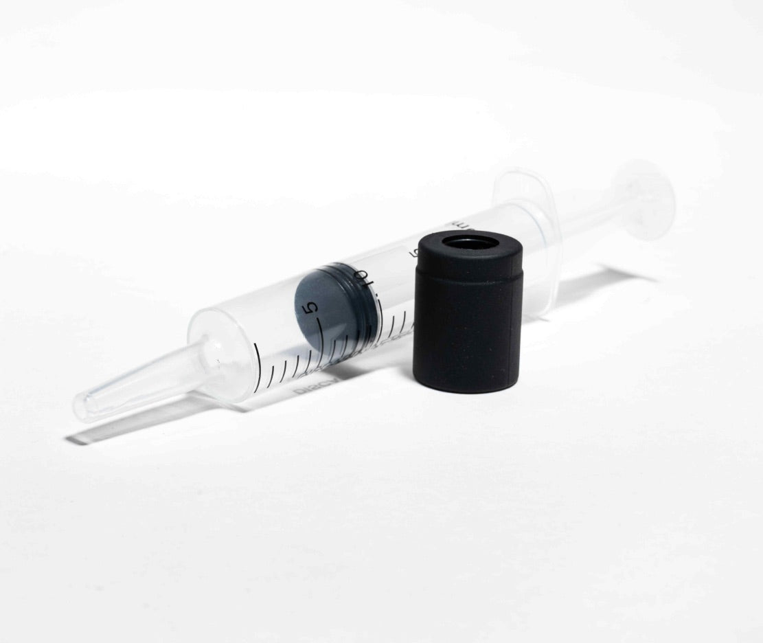 Full Hitoki Cleaning Kit showing syringe, adapter, and components arranged neatly on white background.