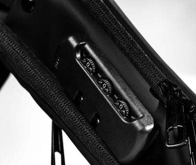 Side view of Hitoki Essentials Bag with built-in combination lock for secure storage.